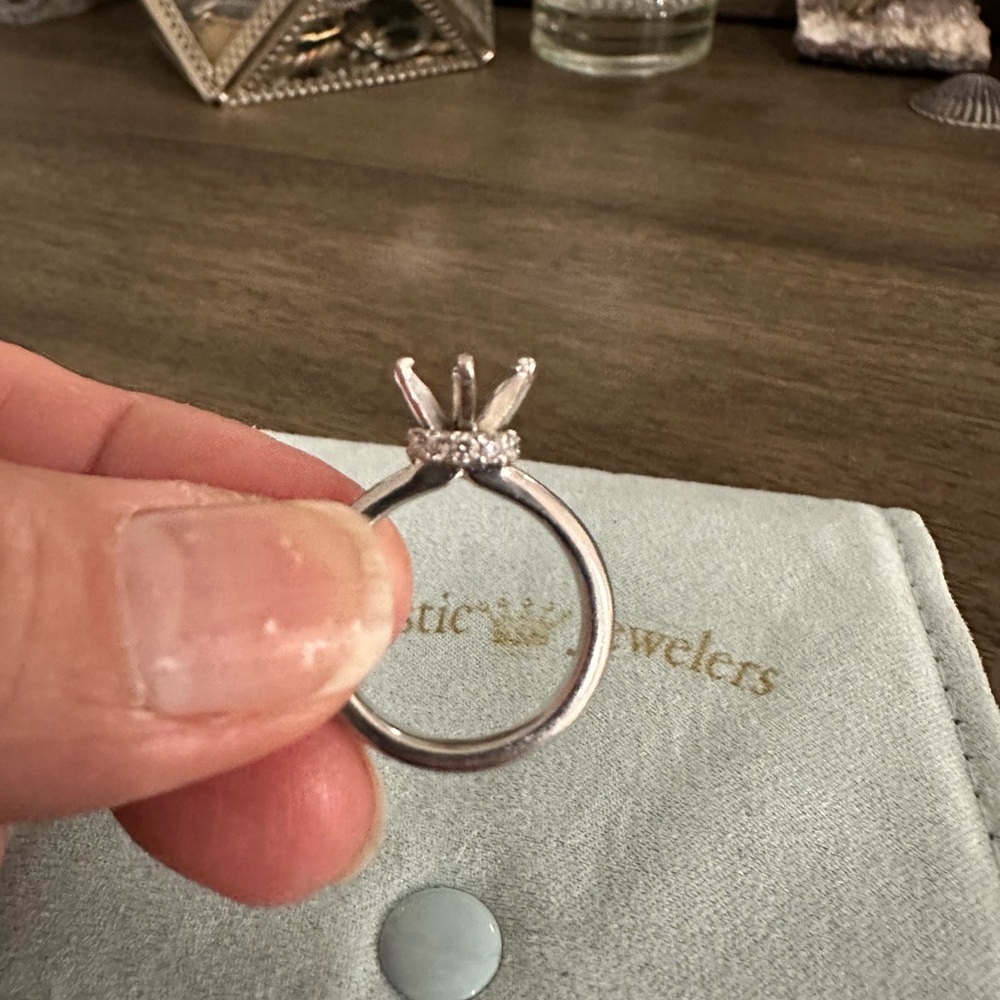 Platinum ring with diamond halo setting